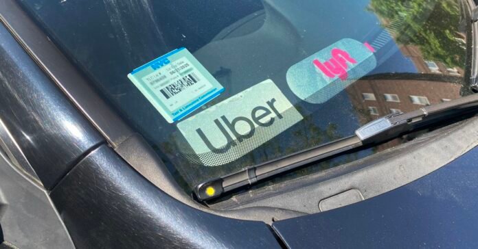 Uber and Lyft Driver, signs in car window, Queens, New York