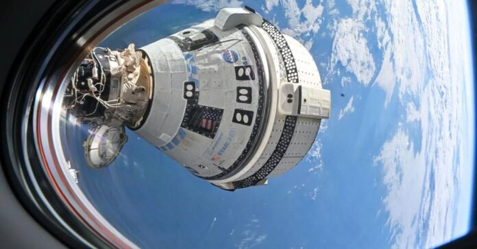 A photo showing the Starliner spacecraft docked at the ISS